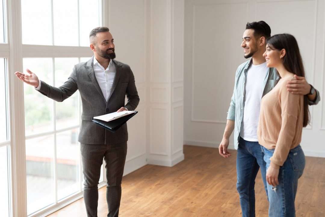 estate-agent-showing-property-for-young-buyers.jpg