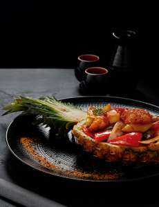 gourmet-japanese-dish-served-in-halved-grilled-pin-2023-11-27-04-56-44-utc-1.jpg