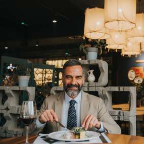 handsome-mature-man-drinking-red-wine-during-lunch-2023-11-27-05-24-15-utc-1.jpg