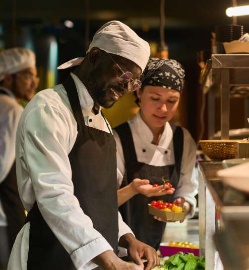 happy-young-african-american-male-chef-mixing-fres-2023-11-27-05-00-41-utc-1.jpg