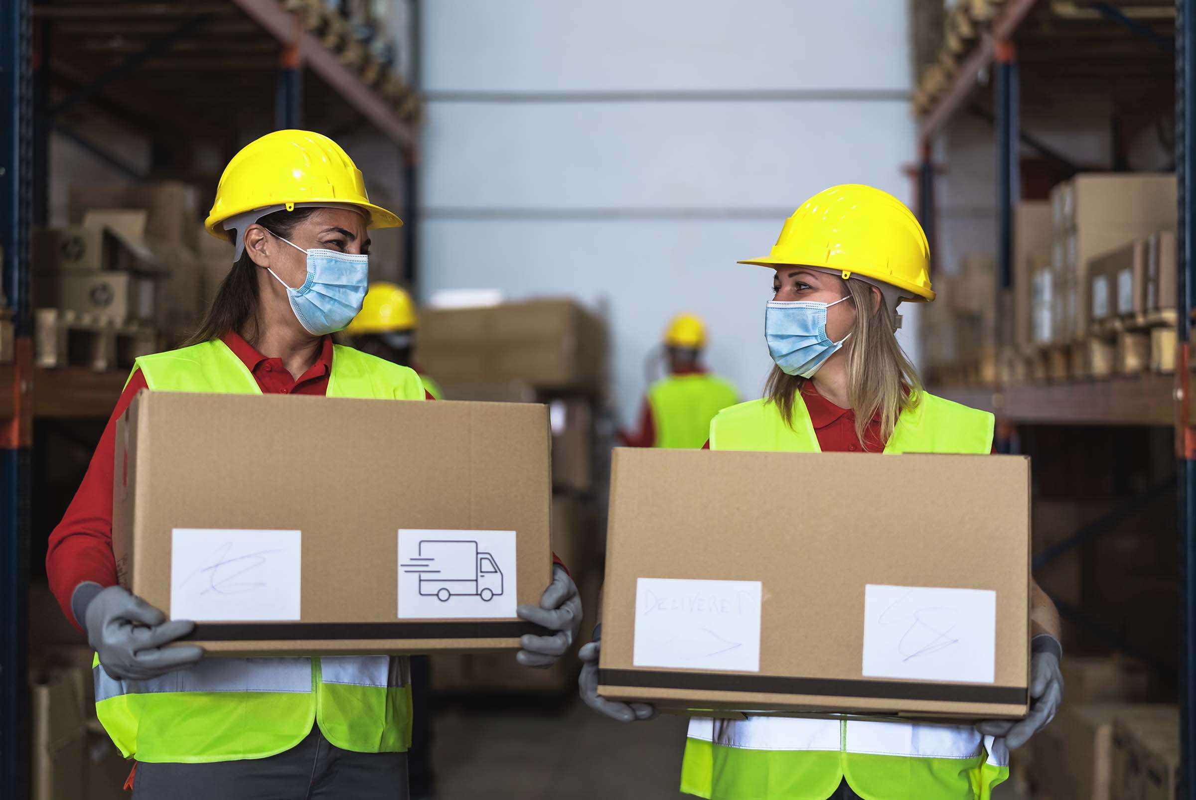 team-working-in-warehouse-loading-delivery-boxes-w-VSJ7DPV.jpg