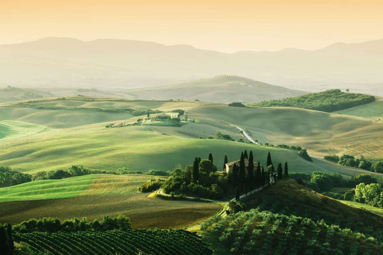 tuscany-landscape-at-sunrise-tuscan-farm-house-vineyard-hills-.jpg